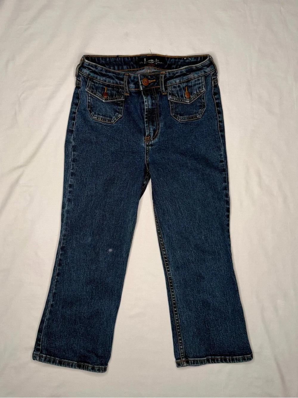 Vintage mid-wash blue denim l.e.i. bootcut jeans for girls.